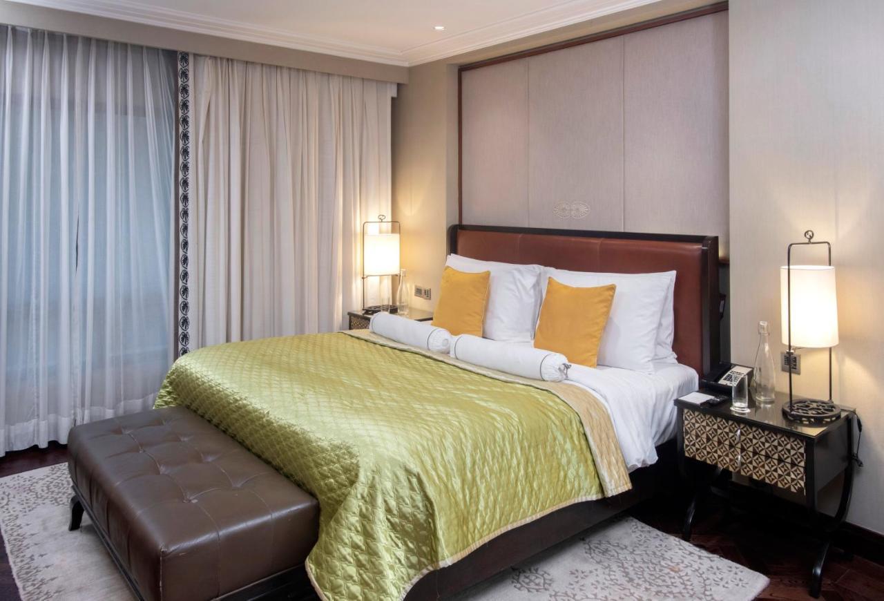 The Claridges New Delhi Hotel Екстериор снимка A bedroom at the Taj Bengal